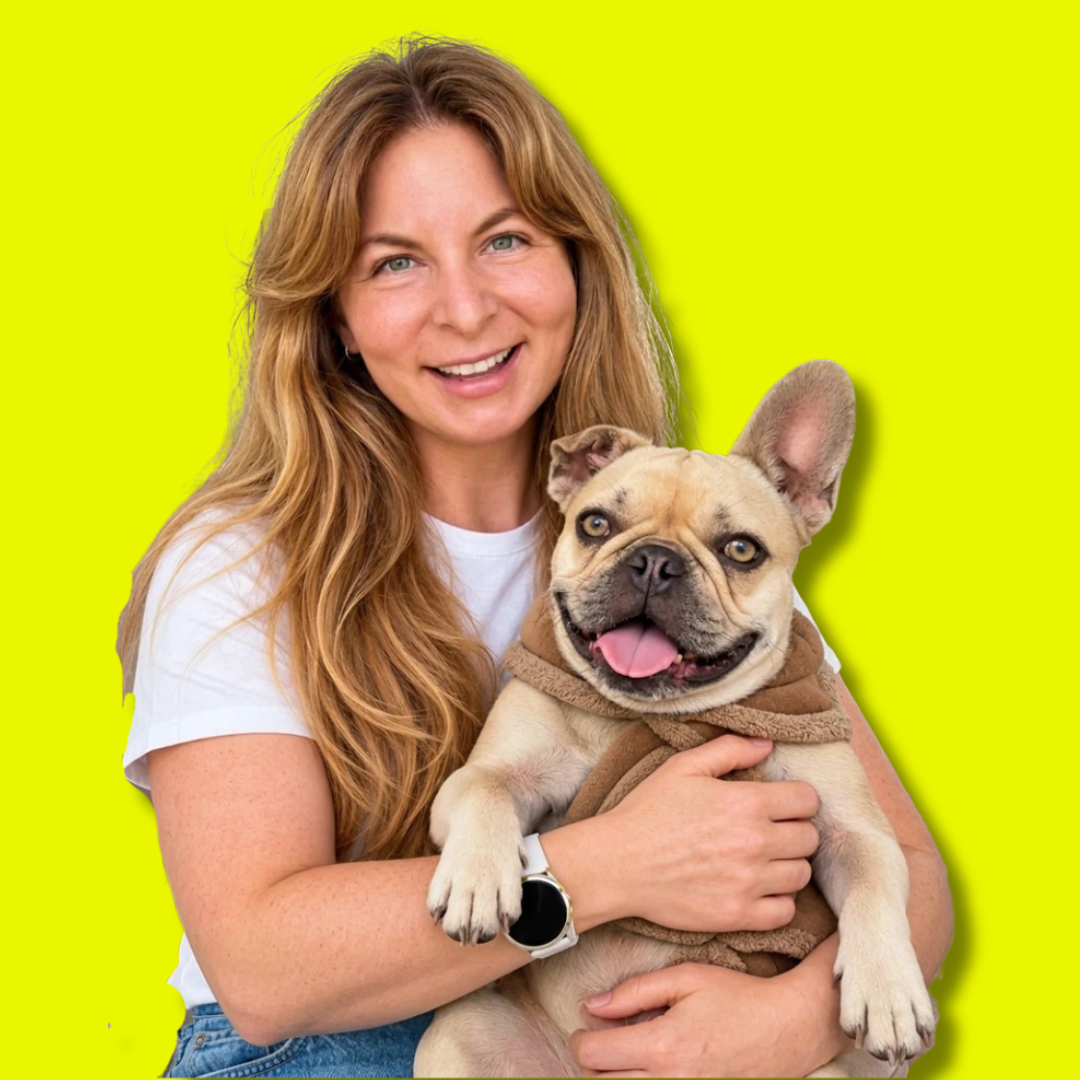 Brigitte Bradford smiling with her French bulldog